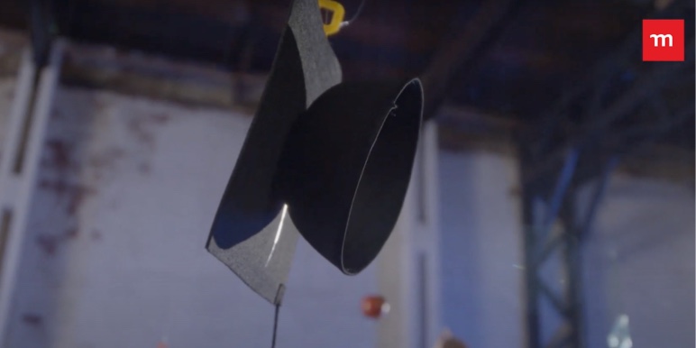 Various educational items, such as a graduation hat hanging from the ceiling of a room.