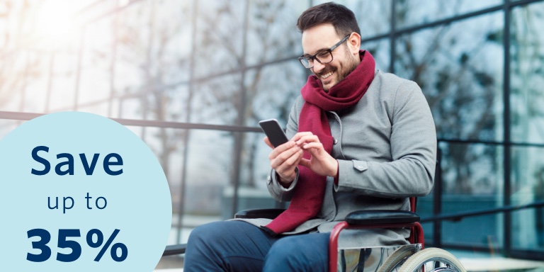 Young man seated in a wheelchair, busy doing an online disability cover quote on his cell phone. He’s smiling because he knows he could qualify for up to a 35% discount on his monthly premiums with Momentum Life Returns.