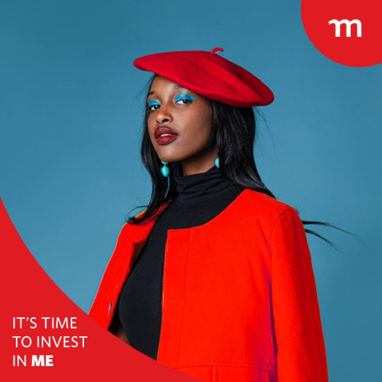 A young female graduate in a red graduation gown and hat boldly looking ahead, ready to save and invest in her life goals.