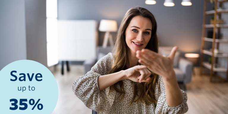 A woman's hand gesture of sign language to someone with a hearing impairment.